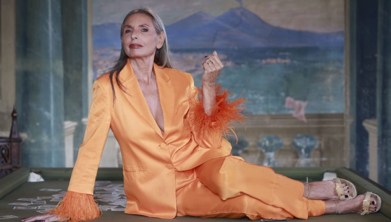 lifestyle influencer Monica Iotti wearing an orange tailleur